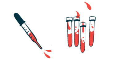 A dropper squirts blood alongside a number of vials of blood.